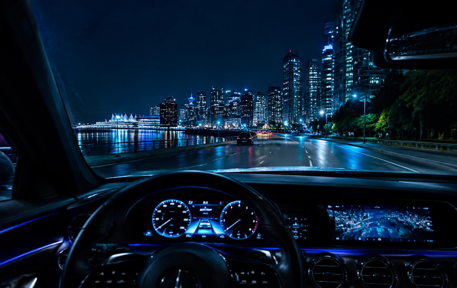Crystal-clear replaced windshield overlooking Vancouver at night